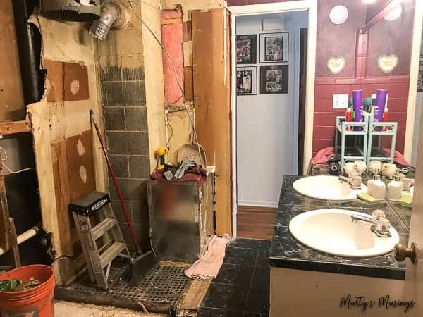 A room with a sink and a mirror