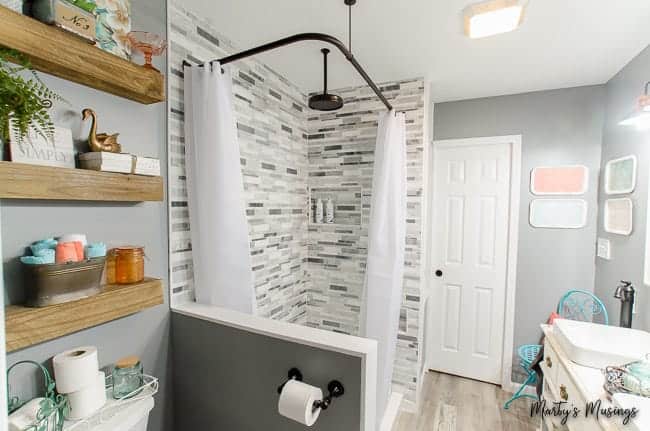 A kitchen with a sink and a mirror