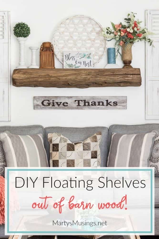 Floating shelves made out of barn wood for a mantel above sofa