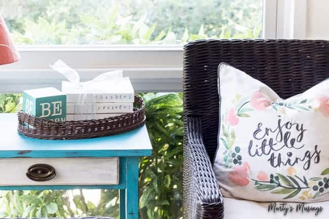 stamped farmhouse books on side table with enjoy the little things pillow