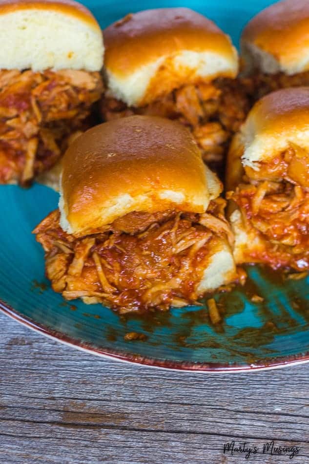 Pork Sliders with barbecue sauce on an aqua plate