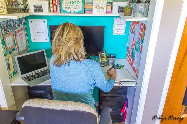 Journaling at home office desk in a closet nook
