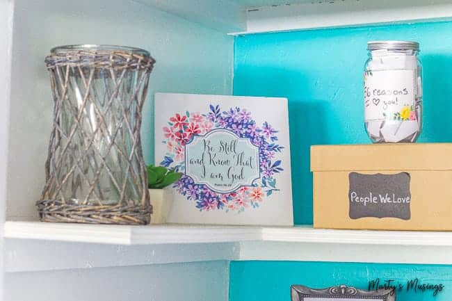 White shelf in closet with accessories on it