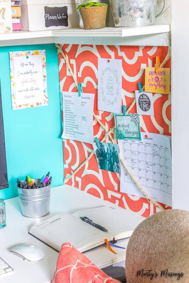 Fabric covered wall with office notes on it