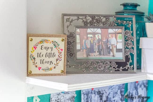 White shelves with memorabilia on it