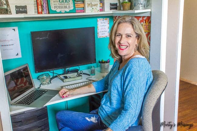 A person sitting in front of a computer