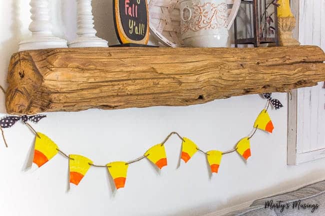 barn wood mantel with candy corn banner