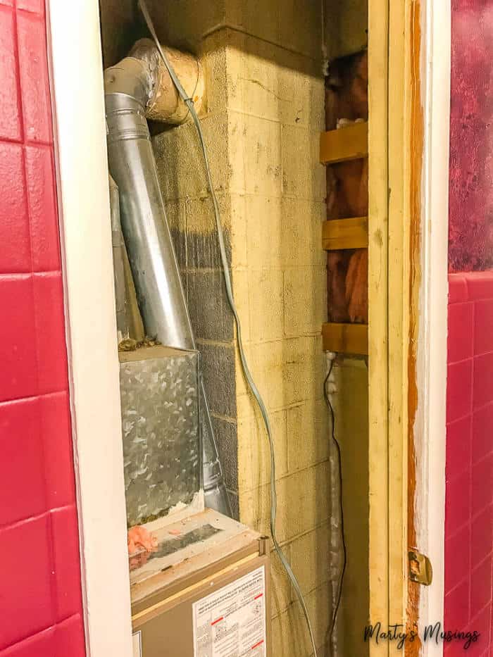 move furnace out of bathroom closet to make small bathroom look larger