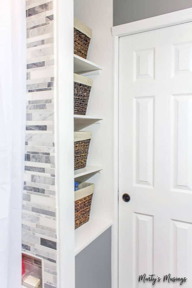 use baskets for storage to make a small bathroom look larger