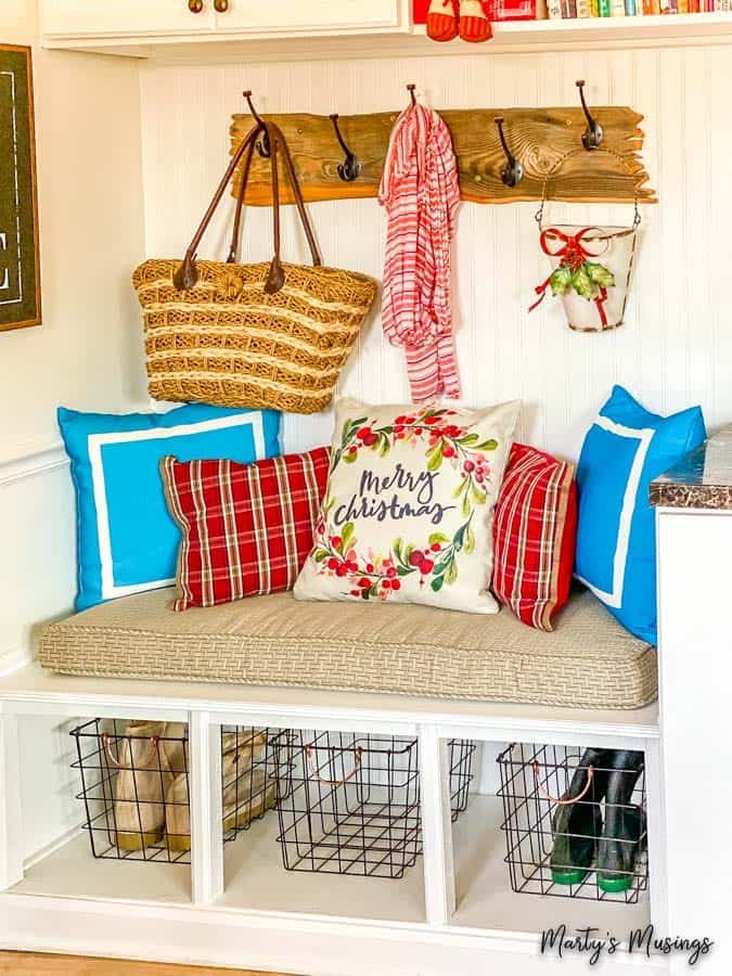 rustic drop zone decorated with blue and red pillow covers