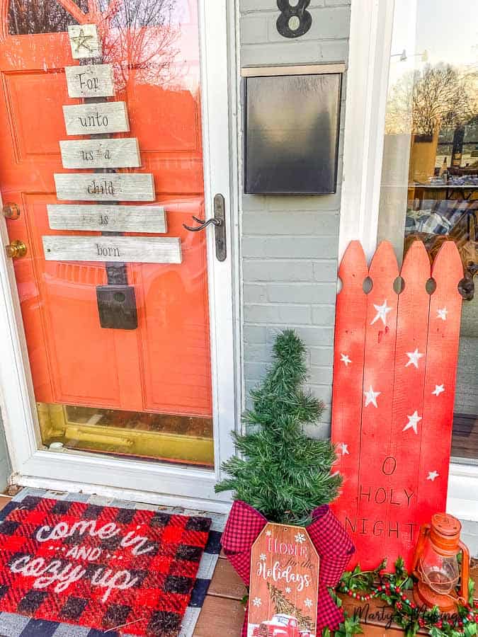 front porch decorated with repurposed Christmas tree