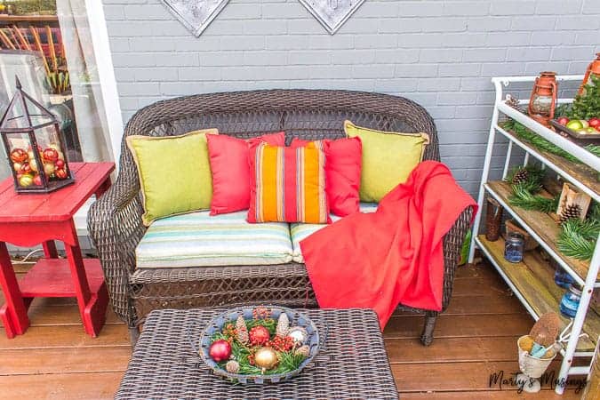 outside love seat decorated for Christmas