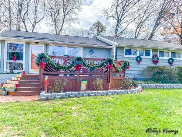 Decorating outside for Christmas with wreaths and garland