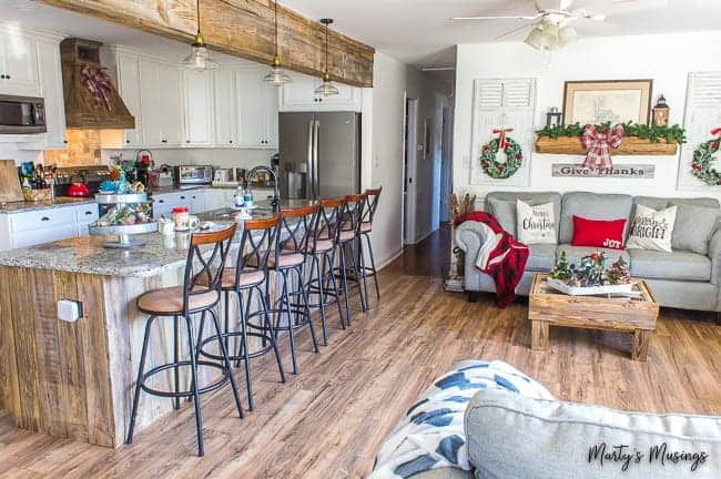 A kitchen with a table in a room