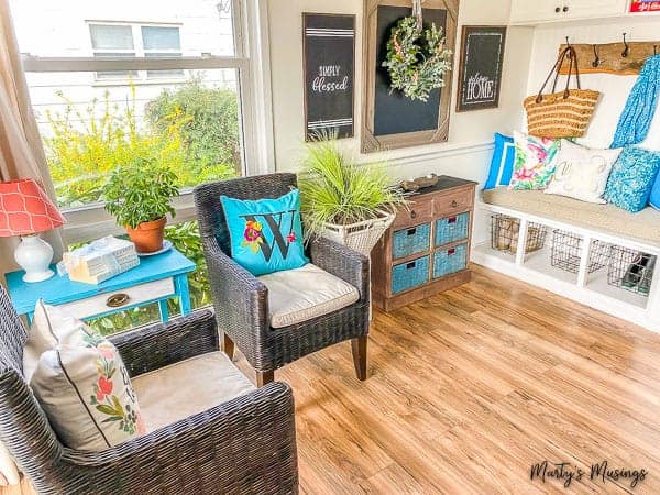 A living room filled with furniture and vase on a table