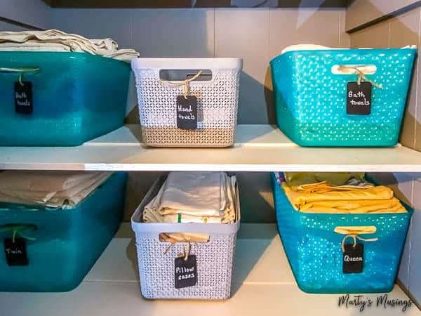 Blue and gray baskets for linen closet storage