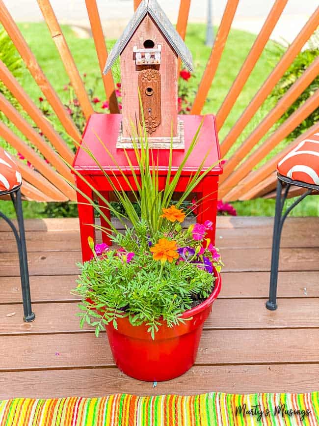 painted red table planter of flowers