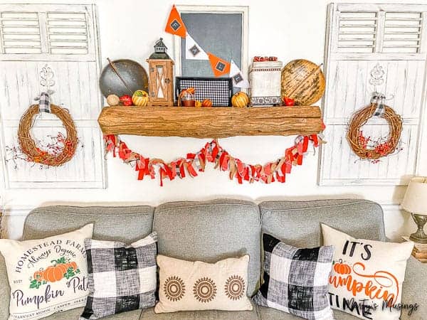 Fall mantel with thrift store accessories and fabric banner