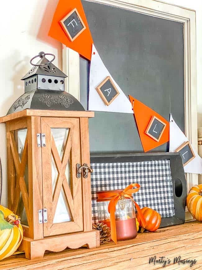 Mantel with fall banner and buffalo check tray