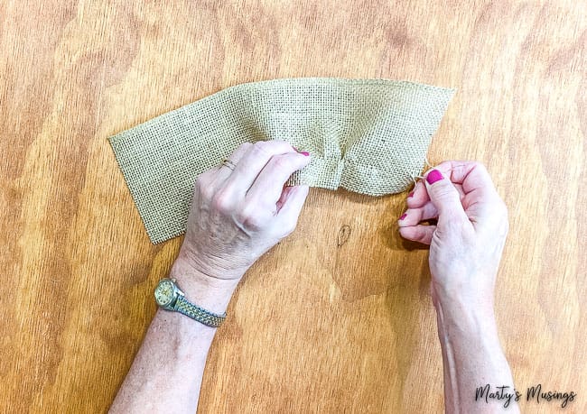 Pull thread through burlap ribbon