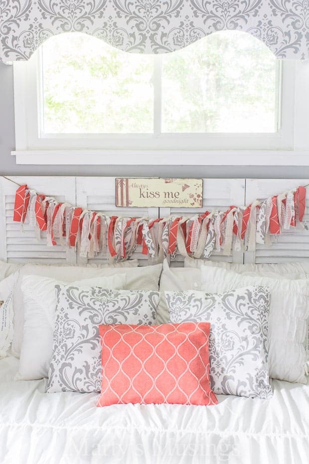Rag banner hanging from bedroom headboard