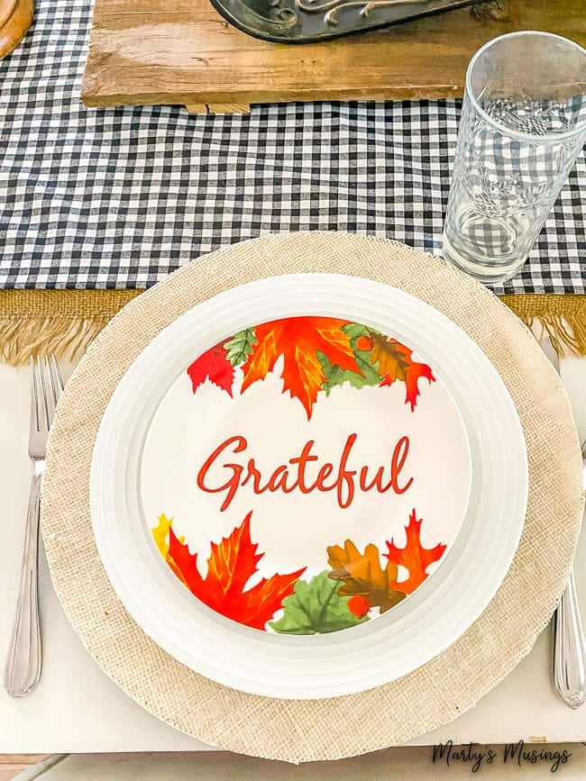 burlap charger with grateful plate and plaid table runner