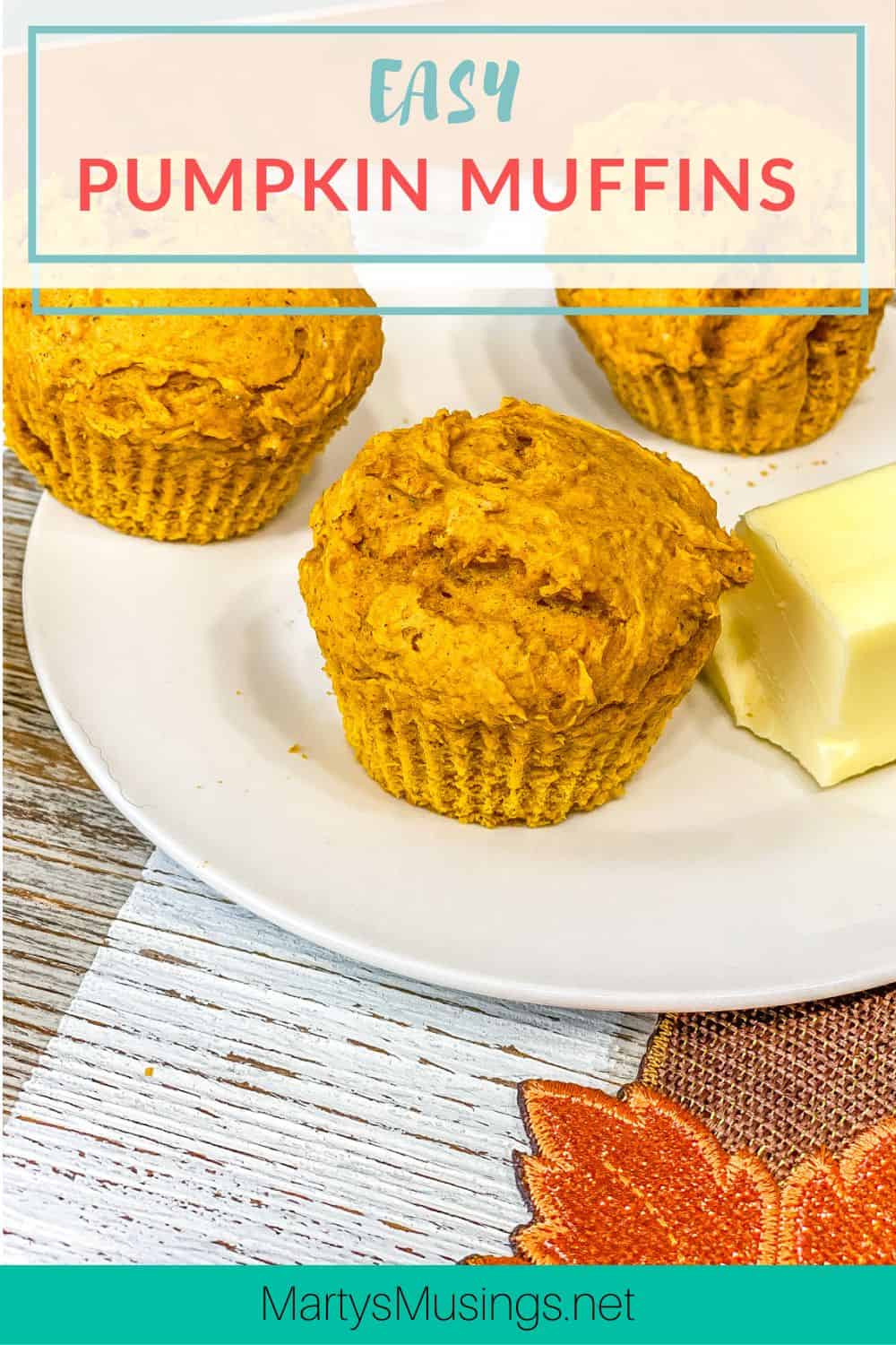 Easy pumpkin muffins with butter on white plate