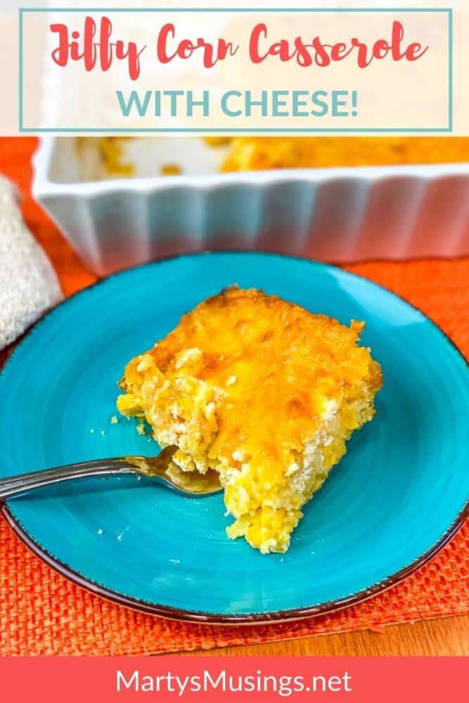 jiffy corn casserole with cheese on blue plate in front of white dish