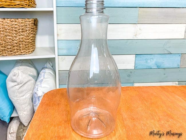 plastic oat milk bottle set on table in craft room