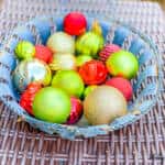 A bowl of fruit sitting on a table