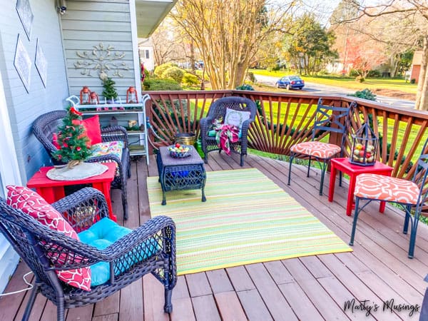 Deck decorated for Christmas with blue and red decorations