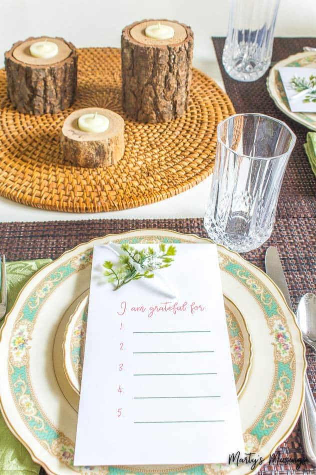 gratitude printable with wood log candles and vintage china