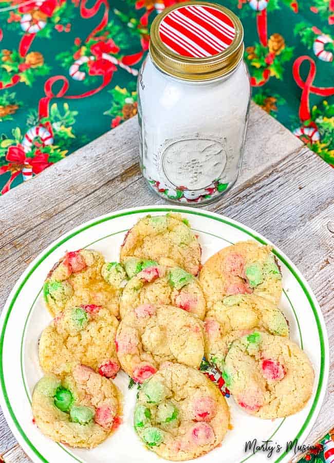 Red and green M&M's on a Christmas plate with cookie mix