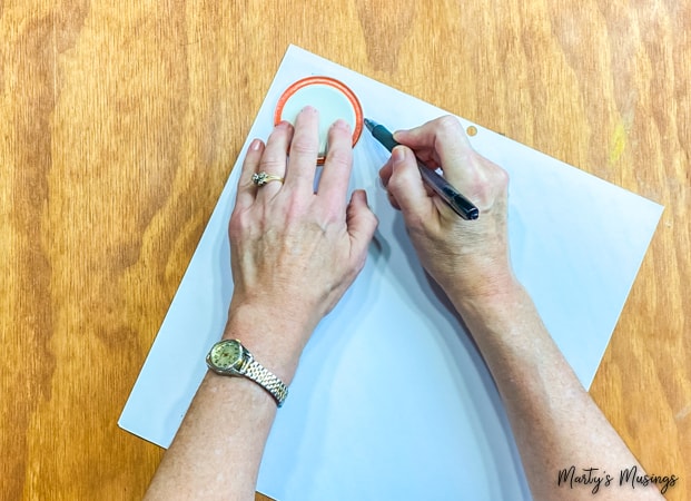 Trace mason jar lid on paper