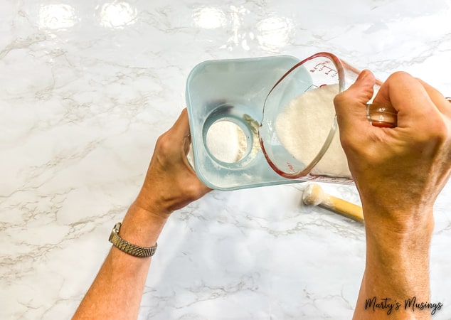 Pour sugar into mason jar