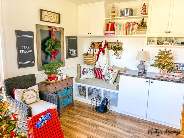 Drop zone in farmhouse style home with red and blue decorations
