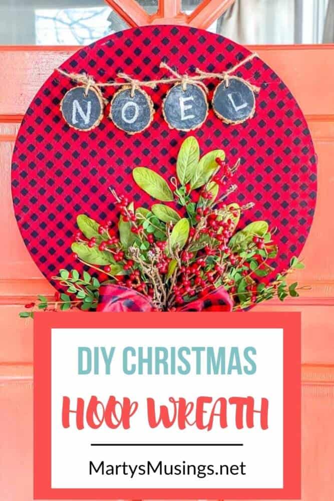 DIY Christmas hoop wreath hanging on coral front door