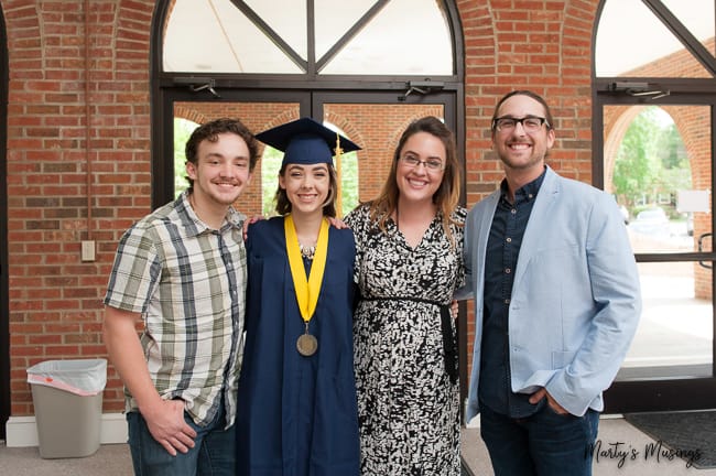 four siblings at high school graduation for girl