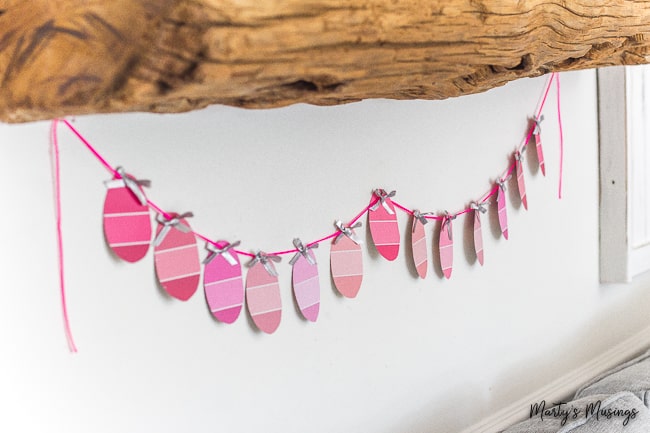 attach silver bows to eager egg banner from paint chips