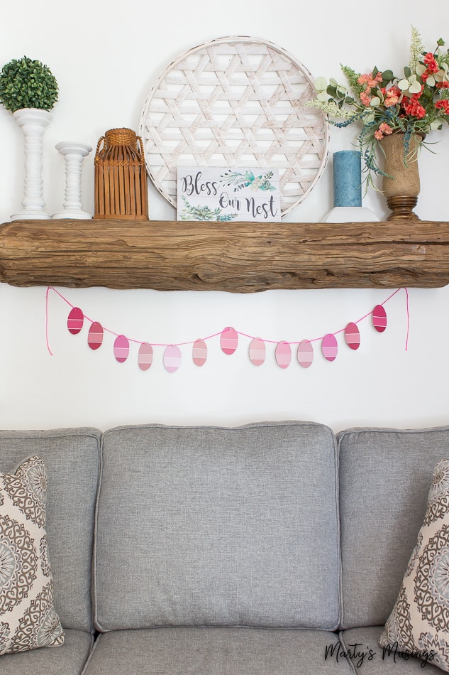 wooden mantel with spring decor and paint chip Easter banner