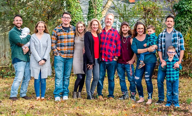 Family with grown children and grandkids outside