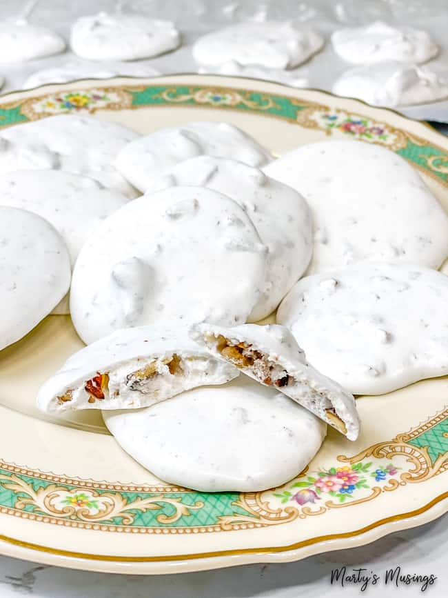 White meringue cookies on vintage plates