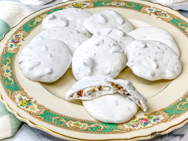 White meringue cookies on vintage plate