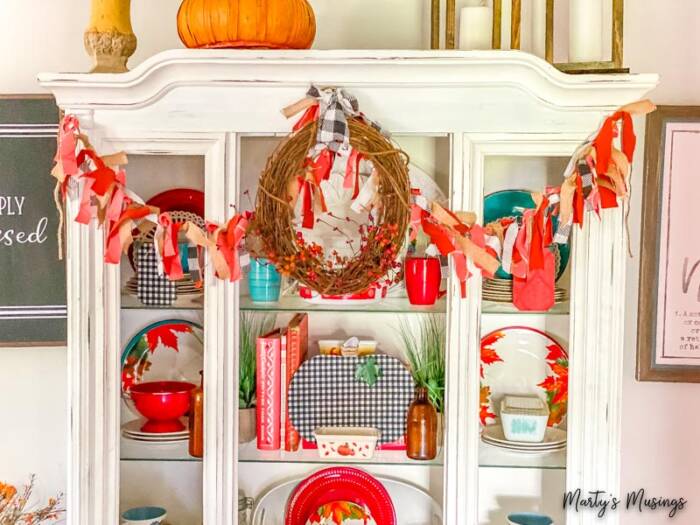 Fabric banner hanging on white hutch for fall