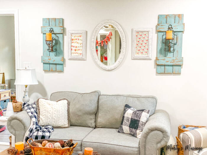 neutral fall living room with blue and orange fall accents