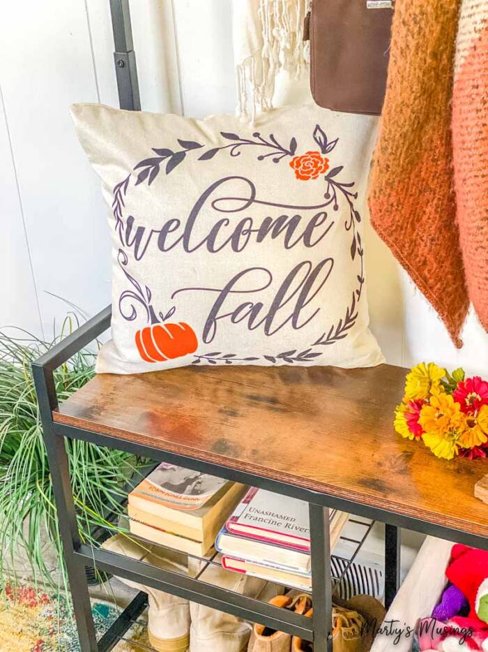 welcome fall pillow and seasonal touches in sun room