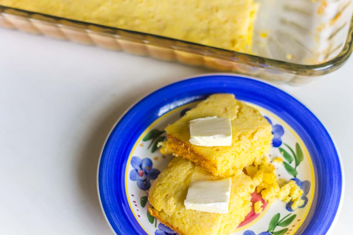 Jiffy Cornbread on blue floral plate with butter on top
