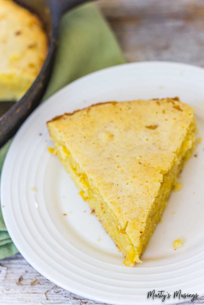 slice of cornbread on white plate