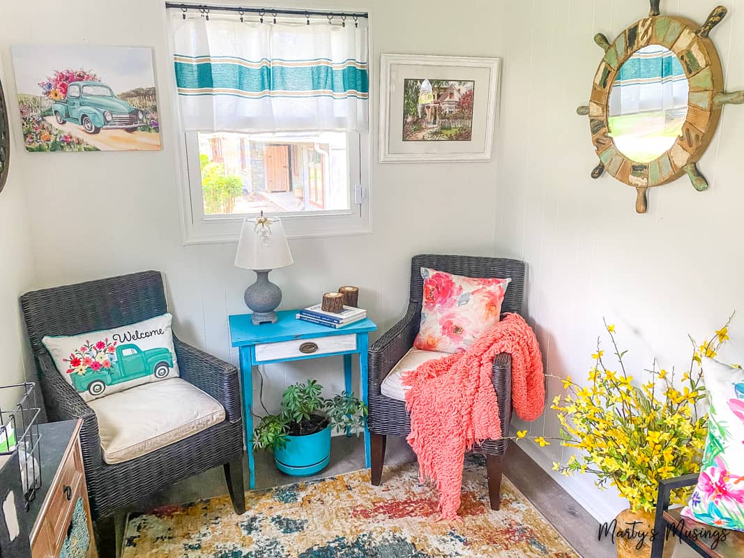 Aqua and coral accents in a cozy sunroom