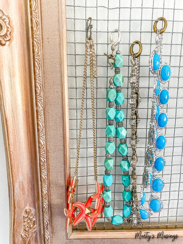 frame and chicken wire used to hang necklaces
